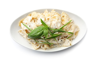 Plate with tasty pasta on white background