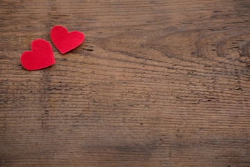 Red heart on a blue wooden board. Copy space