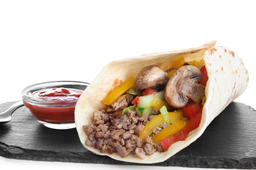 Slate board with tasty taco on white background