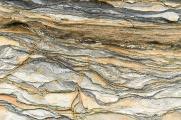 Rock layers - a colorful formations of rocks stacked over the hundreds of years. Interesting background with fascinating texture