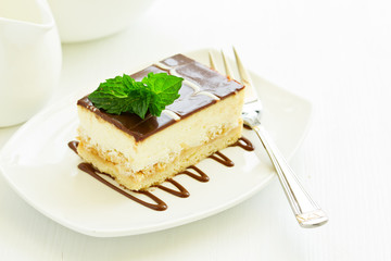 A piece of cheesecake with apple stuffing.