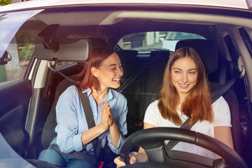 Portrait of beautiful Caucasian women in car