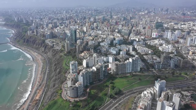 Right travelling and Left Panning aerial view of Miraflores town in Lima,  Peru.
