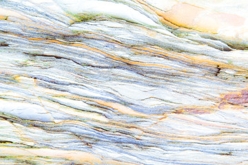 Obraz premium Rock layers - a colorful formations of rocks stacked over the hundreds of years. Interesting background with fascinating texture