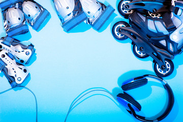  roller skates and knee protection for elbows and hands a set on a blue background sports equipment...