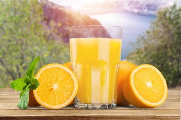 Orange juice and slices of orange on background © BillionPhotos.com