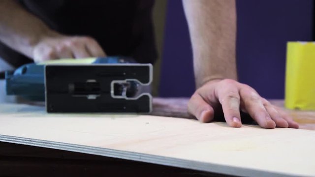 Plywood cutting. Working with  electric fret saw