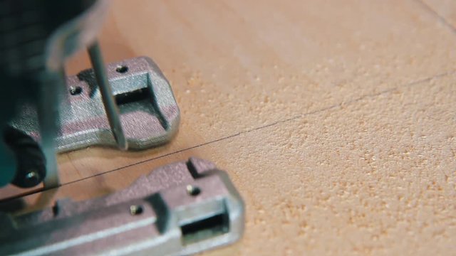 Plywood cutting. Working with  electric fret saw
