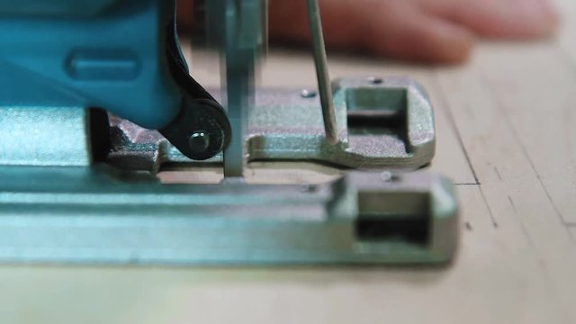 Plywood cutting. Working with  electric fretsaw
