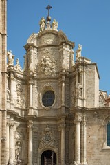Fototapeta premium Valencia Cathedral gates. The church has different architectural styles - roman, gothic and baroque - which make in the main historical landmark of the city