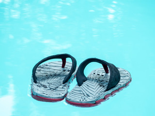 flip flop in the swimming pool.