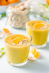 Citrus oatmeal smoothie. Selective focus, space for text.