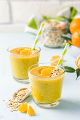 Citrus golden oat smoothie. Selective focus, space for text.