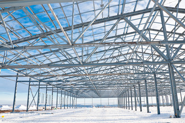 Fototapeta premium Structure of building. Steel construction on sky background