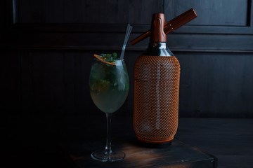 Amazing alcoholic cocktail in an elegant glass with tequila with vanilla syrup and fresh mint...