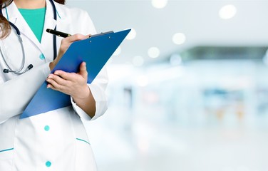 Young man doctor holding stethoscope