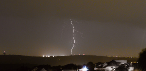 Lightning strikes during thunderstorm over the city