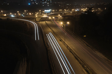 Autumn night light trails at entrance of the city.