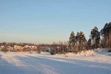 Fototapeta na wymiar winter landscape with snowy trees and blue sky