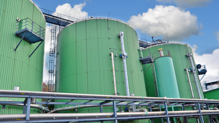Biogas tanks on a biogas plant. Wastes recycling ecology concept. Green economics.