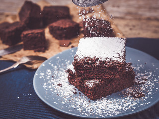 sugar powder or confectioners sugar over brownie