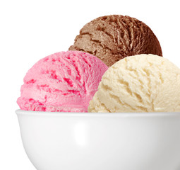 Vanilla, strawberry and chocolate ice cream scoops in bowl isolated on white background