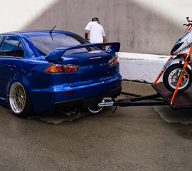 motorcycle towing on a car