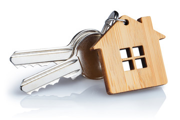 House keys with house shaped keychain, isolated on white background