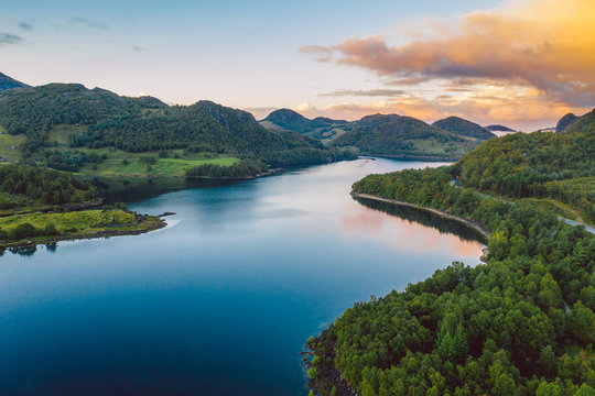 a lake in Norway with beautiful sunrise in background