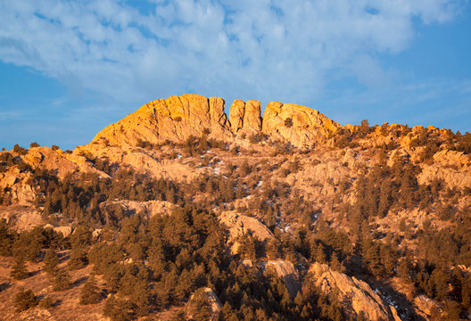 Horsetooth rock formation at sunrise is a distinctive geological and popular mountain landmark overlooking Fort Collins, Colorado, USA