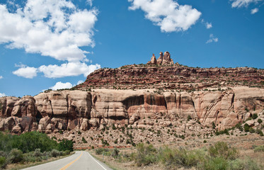 Road in front of big rocks in southwest USA