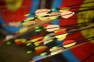 Arrows from a bow accurately hit the target.