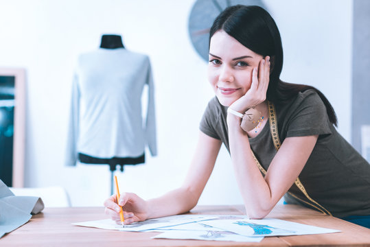 Young girl creating beautiful dresses