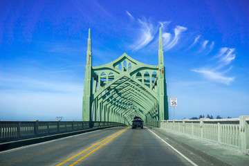 Driving on the Conde B. McCullough Memorial Bridge, Oregon, formerly the Coos Bay Bridge, on a sunny day
