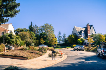 Street in the residential area of Oakland on a sunny autumn day, San Francisco bay area, California