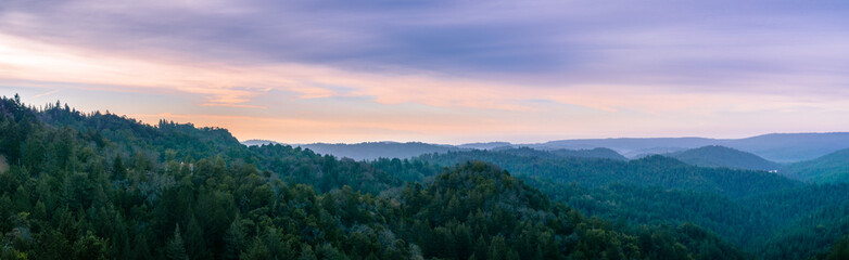 Early morning panorama in Santa Cruz mountains; Monterey bay and the Pacific Ocean visible in the background; San Francisco bay area, California