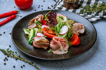 Salad with roast beef and poached egg