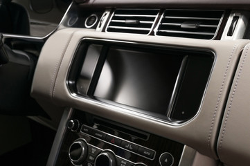 Panel of modern car with screen multimedia system. Auto interior detail.