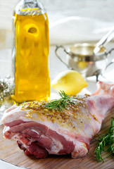 lamb leg raw with olive oil and mustard seeds marinade