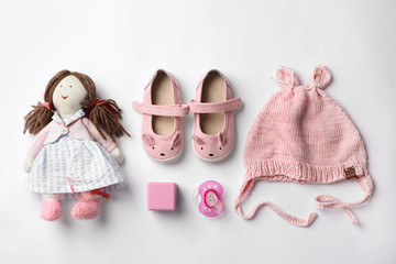 Flat lay composition with baby accessories on white background