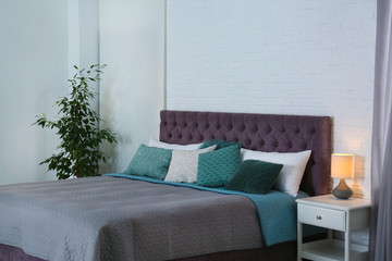Contemporary room interior with comfortable double bed