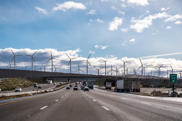 Driving on the interstate towards Palm Springs; Wind turbines installed at the entrance to Coachella Valley; Los Angeles county; Riverside county; south California