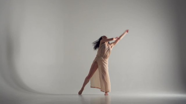 Beautiful woman freestyle dancing in studio