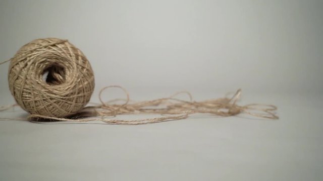 Moving skein with a natural grey background.
