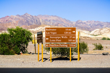 Posted road directions and distances close to the Furnace Creek Visitor Center; desert and...