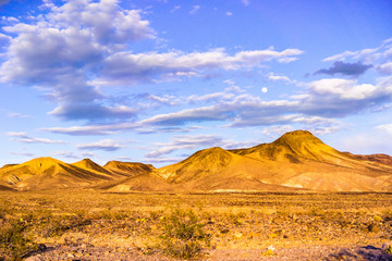 Beautiful sunset landscape, full moon up in the sky, Death Valley National Park, California