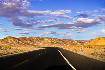 Fototapeta na wymiar Driving through Death Valley National Park at sunset, California