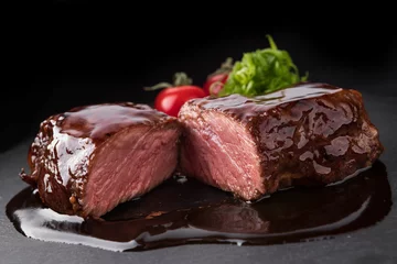 Foto auf Alu-Dibond Sliced Pork Steak in Teriyaki Sauce on Black Stone © pobaralia