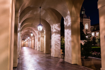 Night view of the colonnade surrounding the historical City Hall building of Pasadena, Los Angeles county, California; the building was completed in 1927;