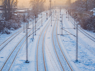 Empty train tracks covered in snow